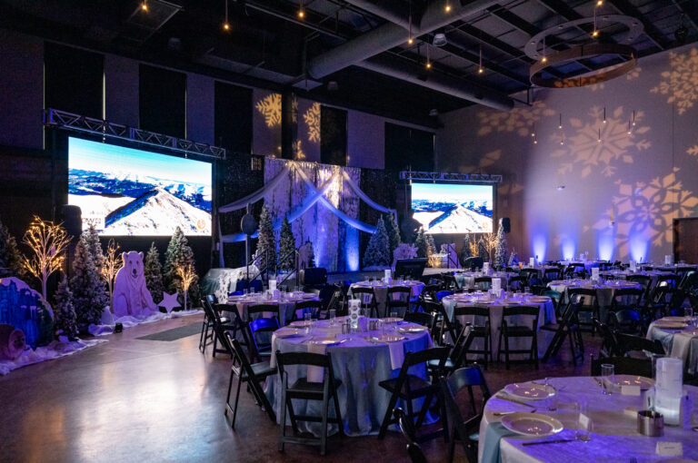 A fully holiday themed corporate party in a large event space