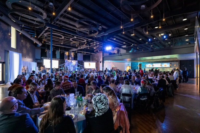 People fill a large event space